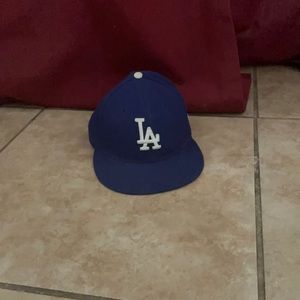 A blue dodgers hat